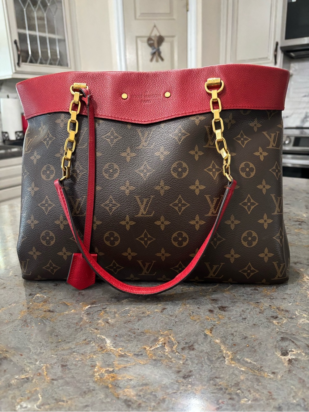 Louis Vuitton Monogram Shoulder Bag with Red Trim and Gold Chain